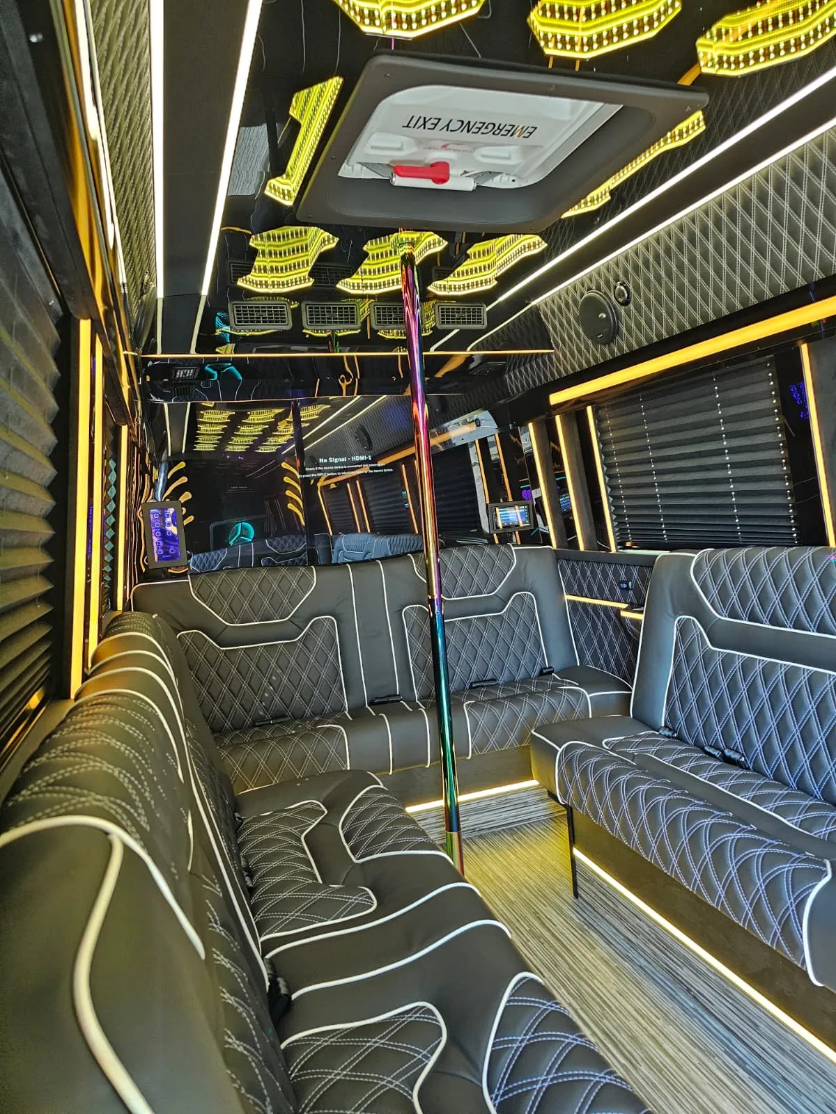 Limo Sprinter perimeter lounge seating under warm ambient lighting